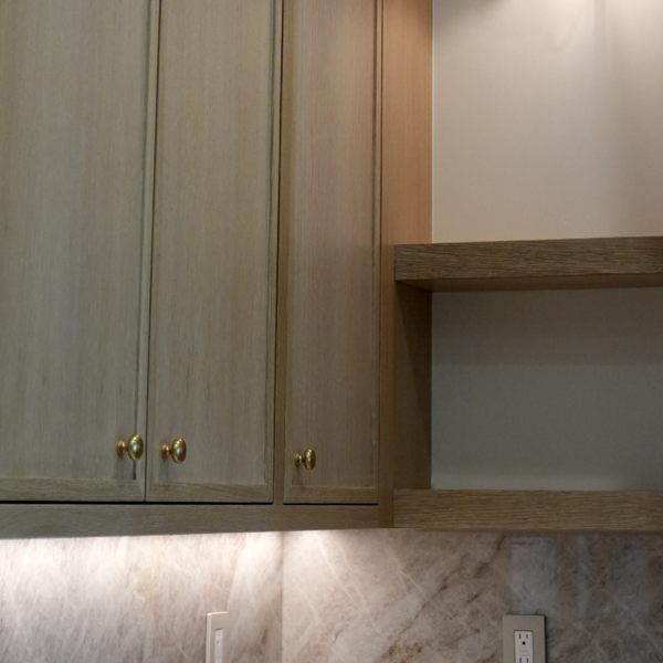 Kitchen cabinetry with warm under-cabinet lighting